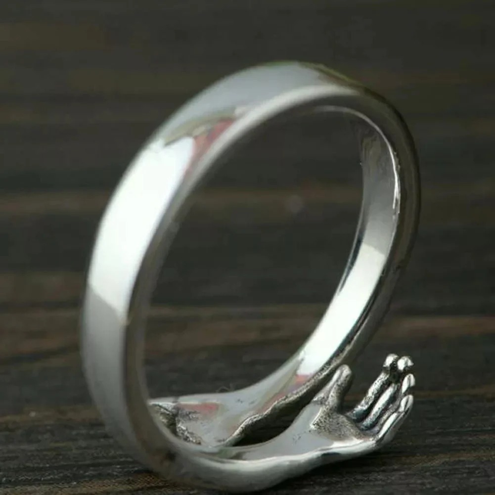 couple hug ring